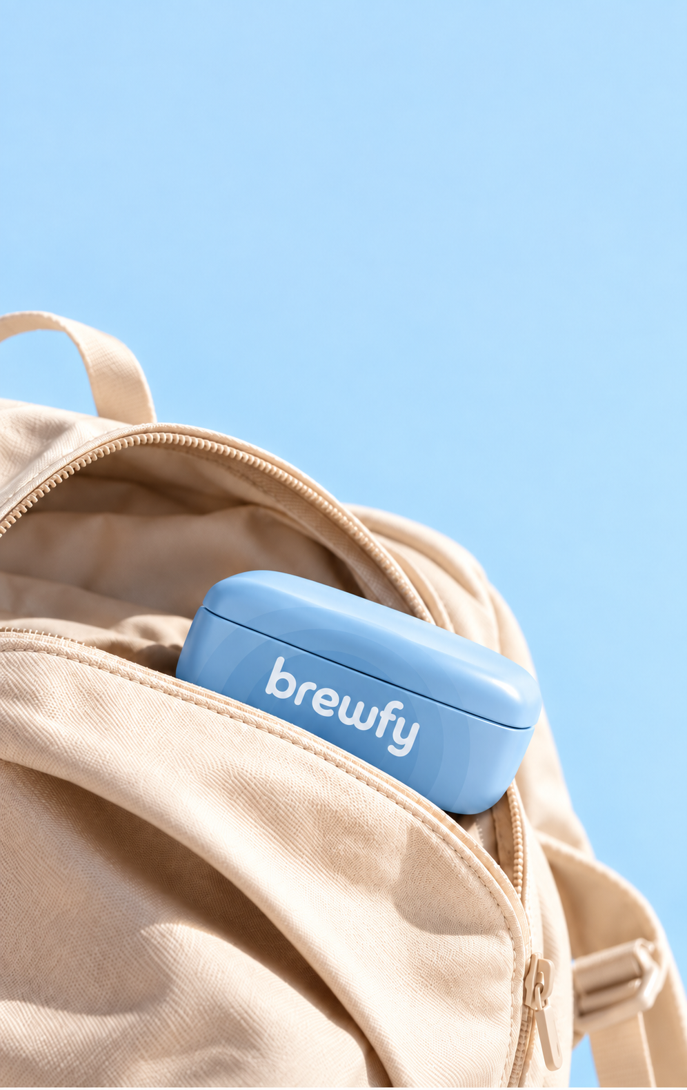 Compact blue BREWFY tin tucked into the front pocket of a cream backpack